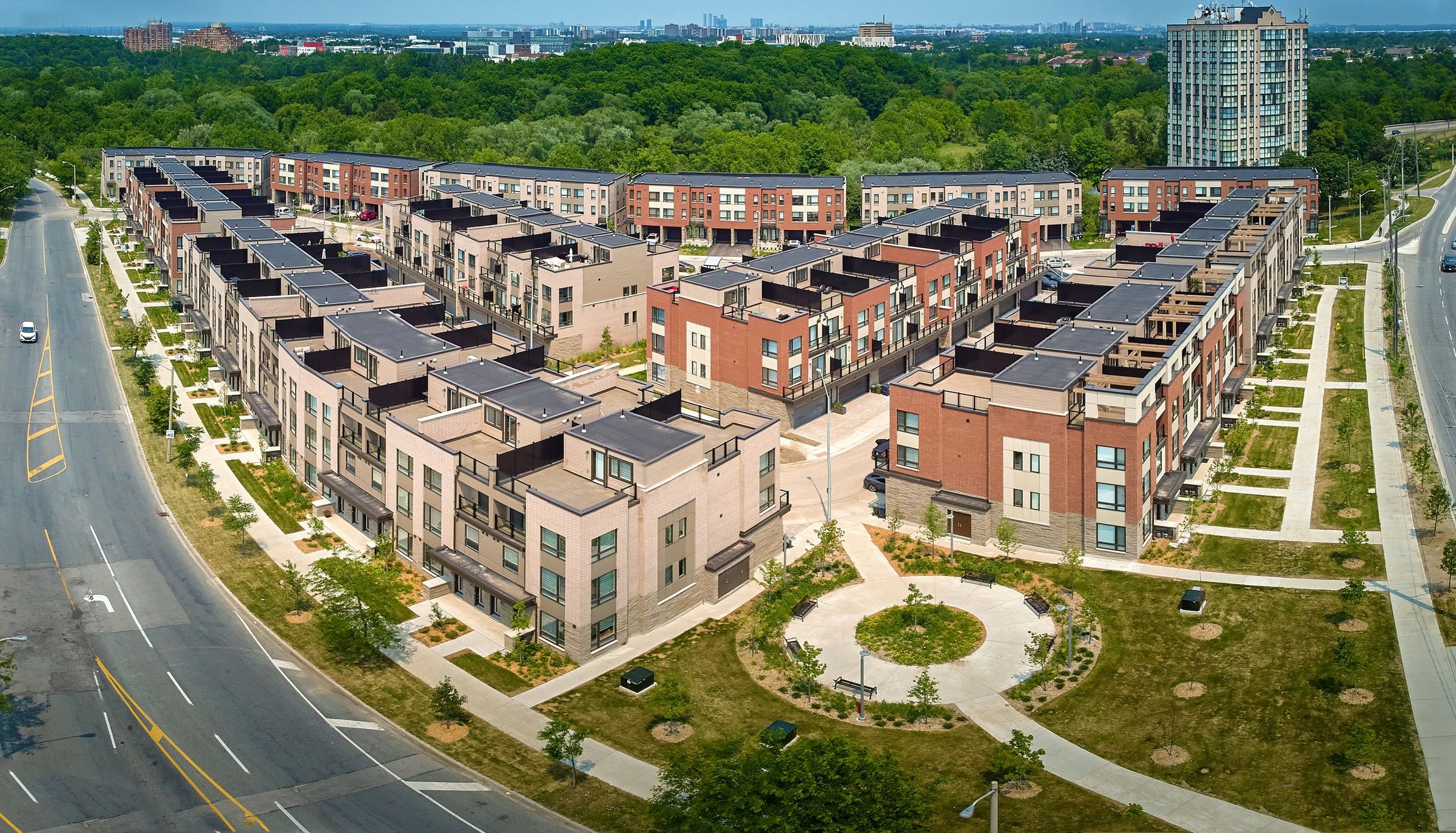 Aerial view of townhomes with rooftop solar panels