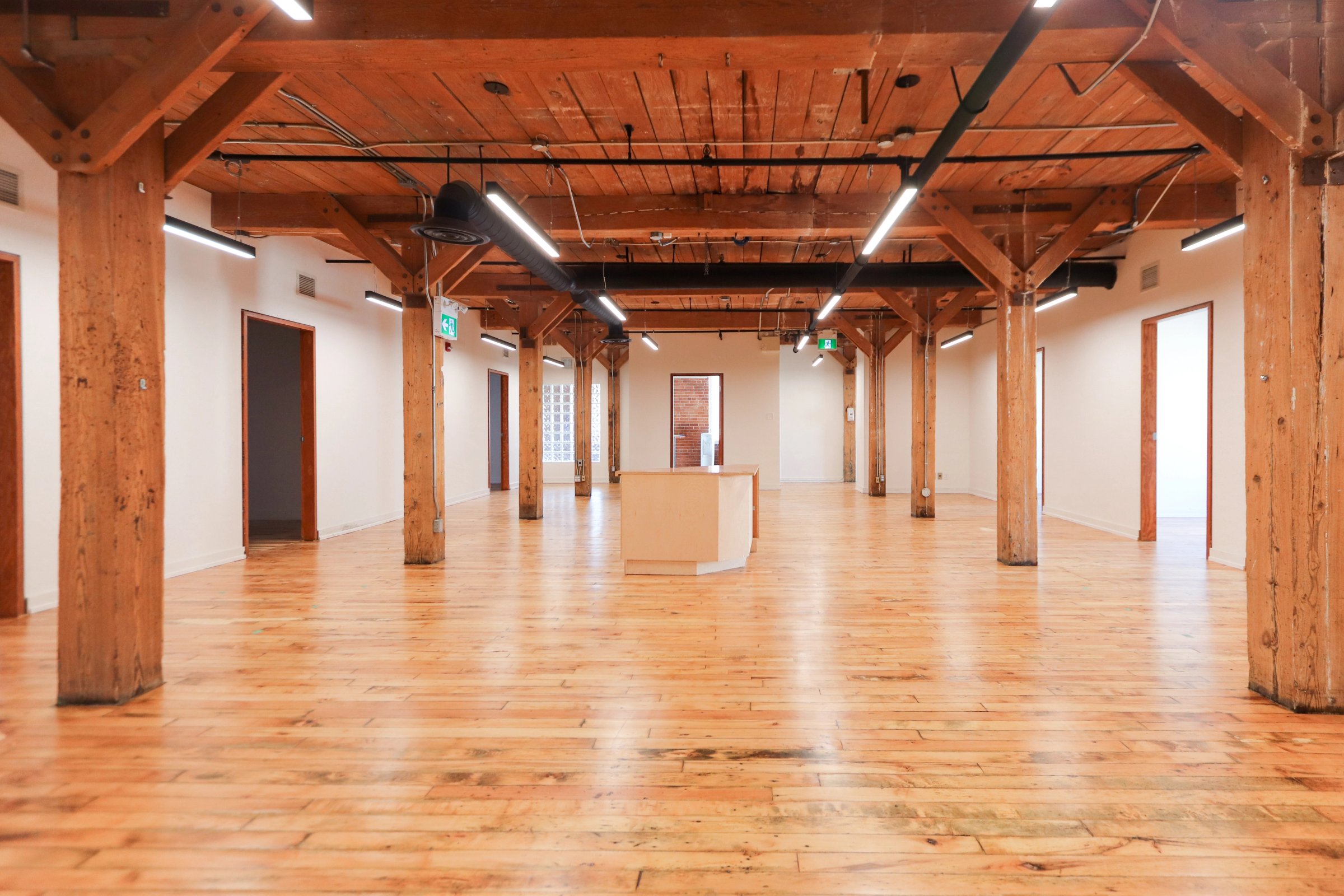 Empty office floor with timber posts and beams