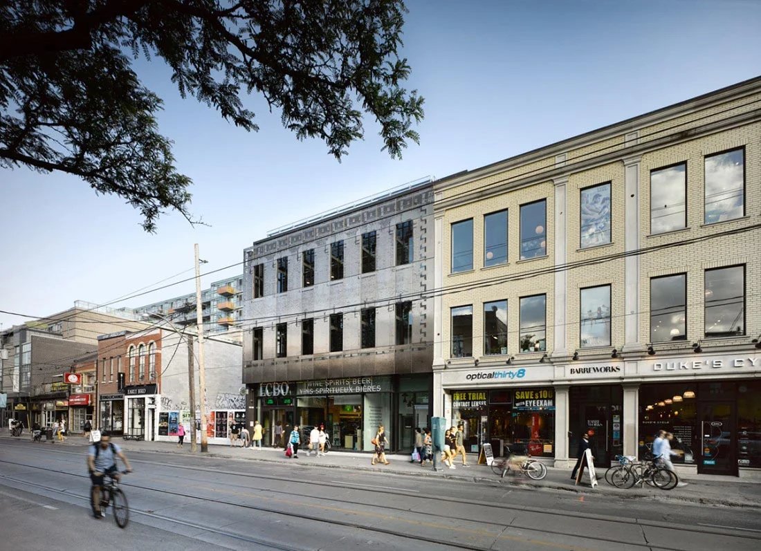 Restored brick storefronts on a streetcar street