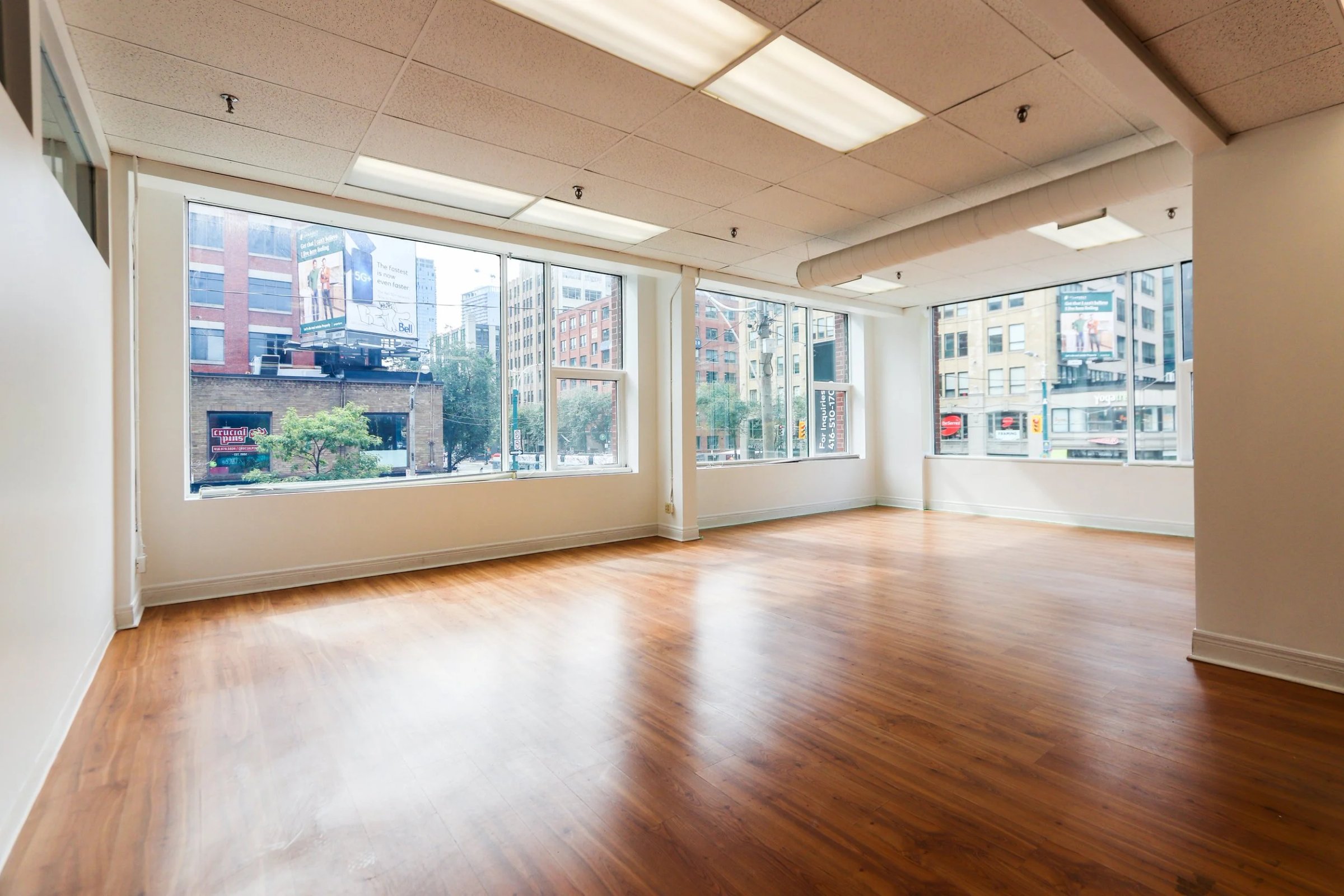 Empty office floor with wood and corner windows