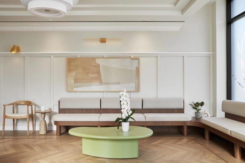 White lounge with herringbone wood floor