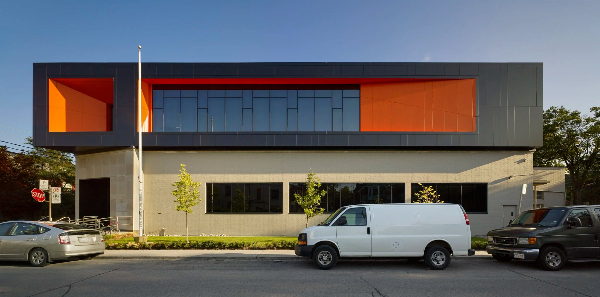 Grey office block with orange window recesses
