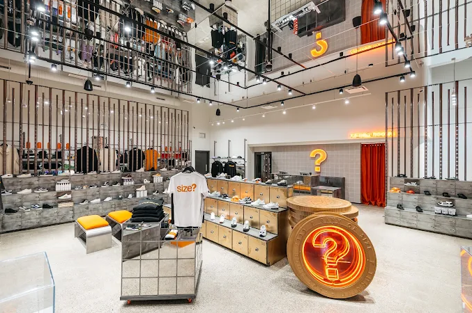 Sneaker store interior with mirrored displays