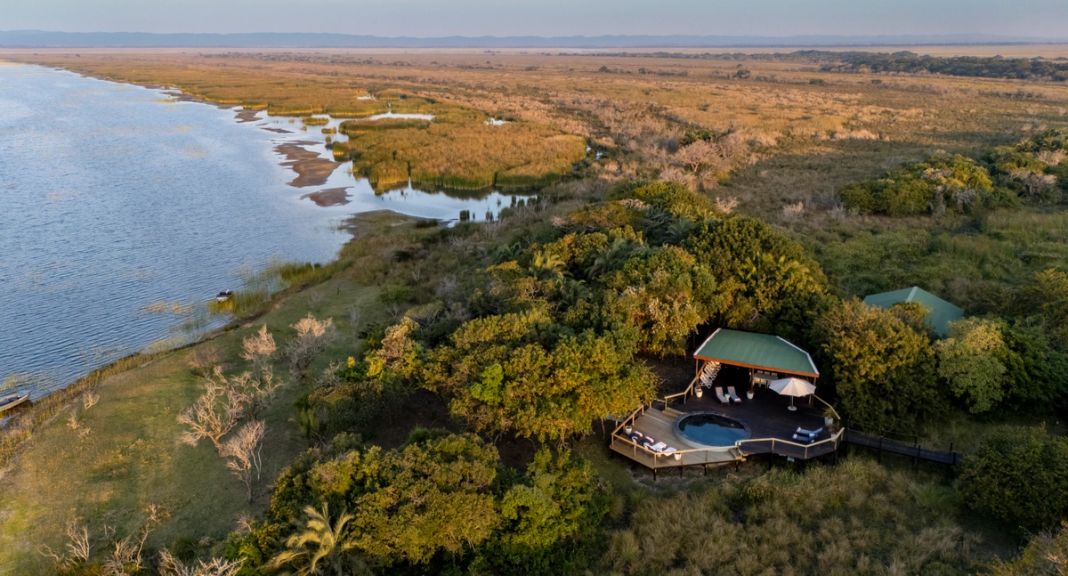 Aerial view of the lodge deck and plunge pool tucked into dune forest on the wetland edge of Lake St Lucia.