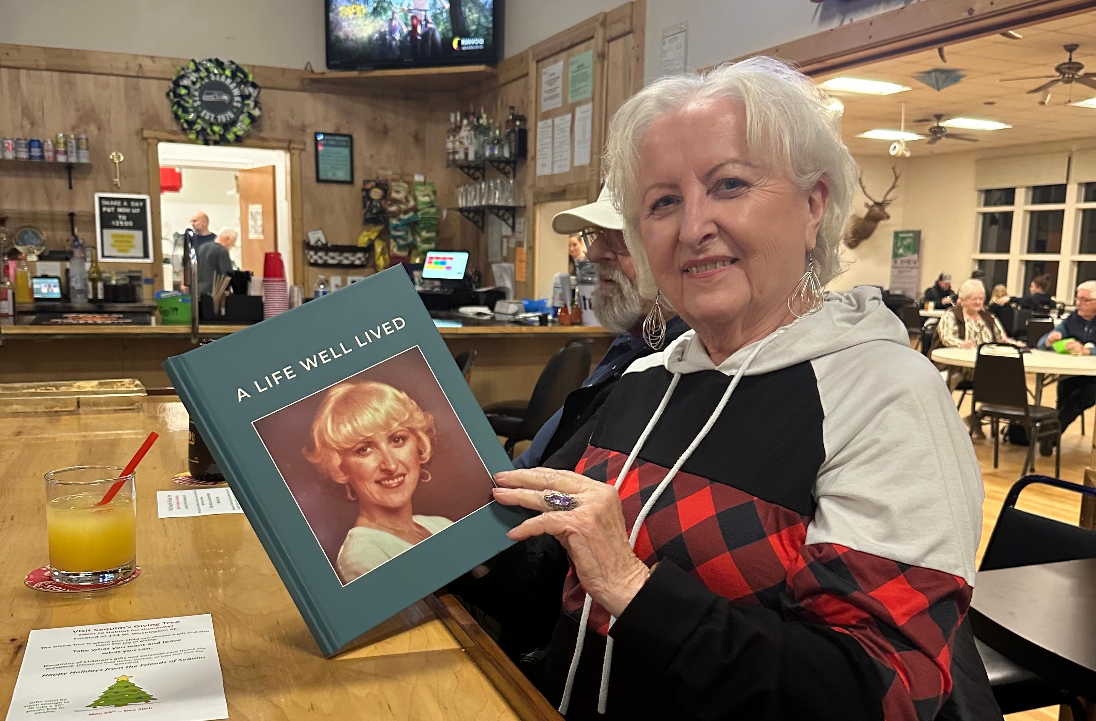 A lady with her finished life story book