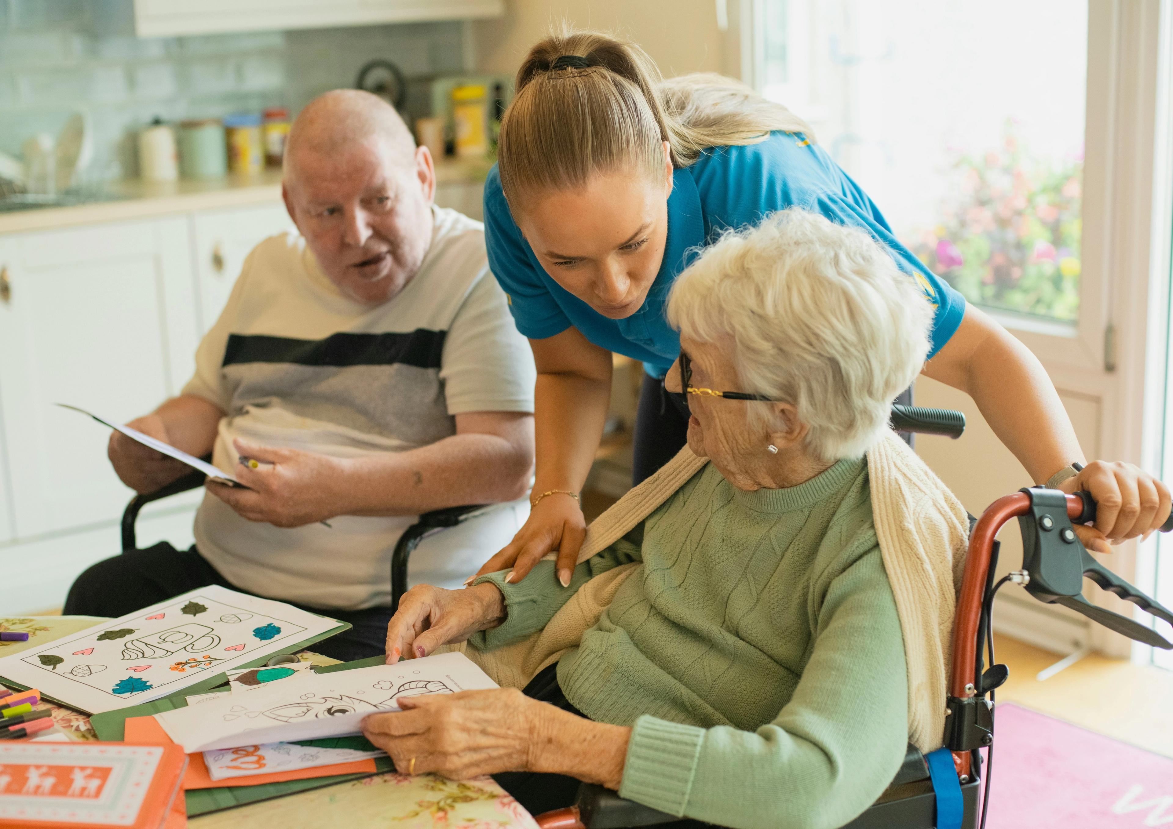 Someone helping an older person in a kitchen