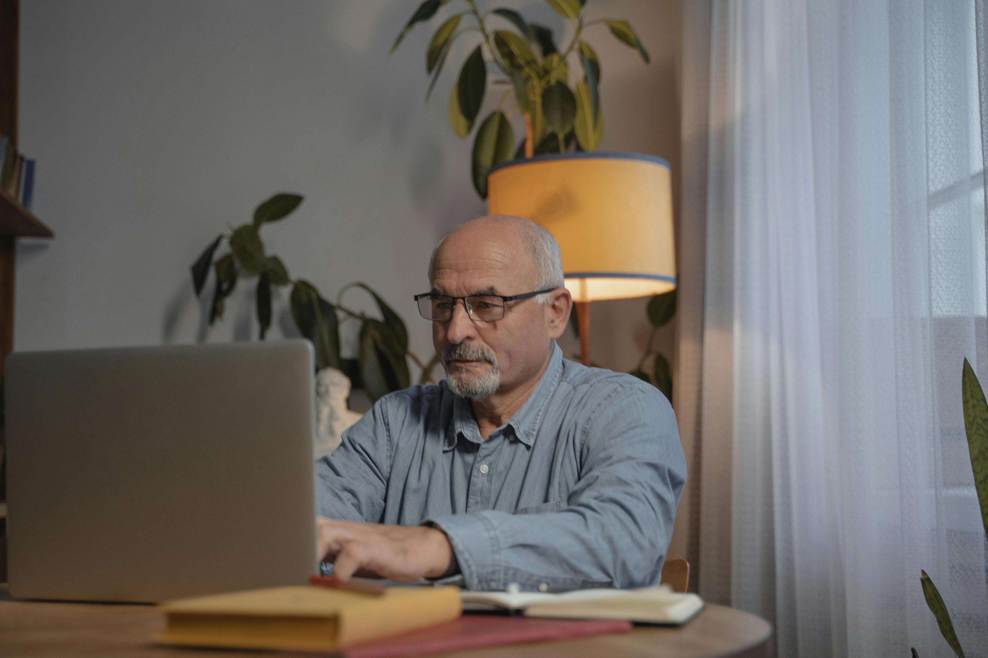 A man at a desk writing his memoir