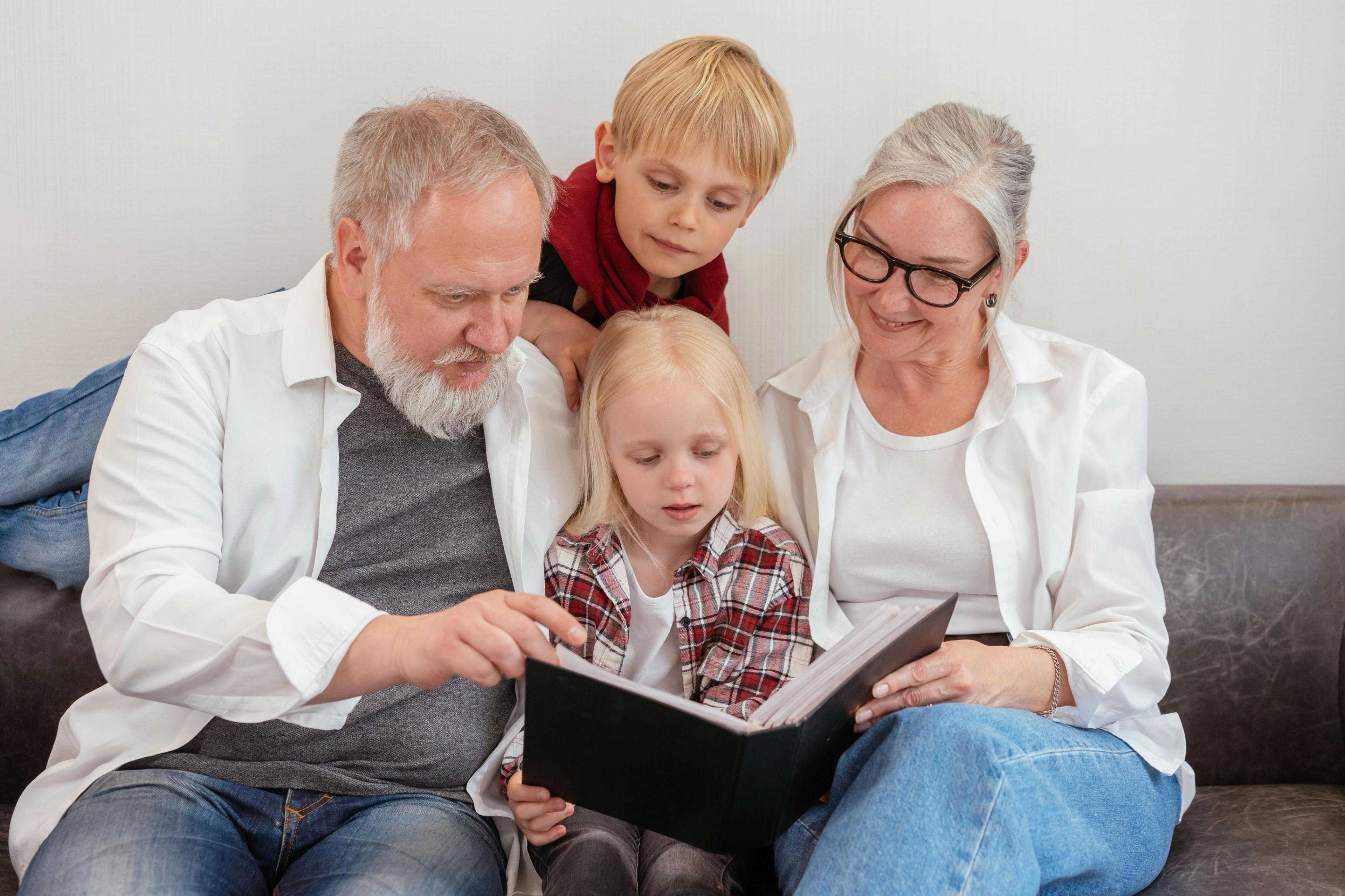 Grandparents and children reading a memoir