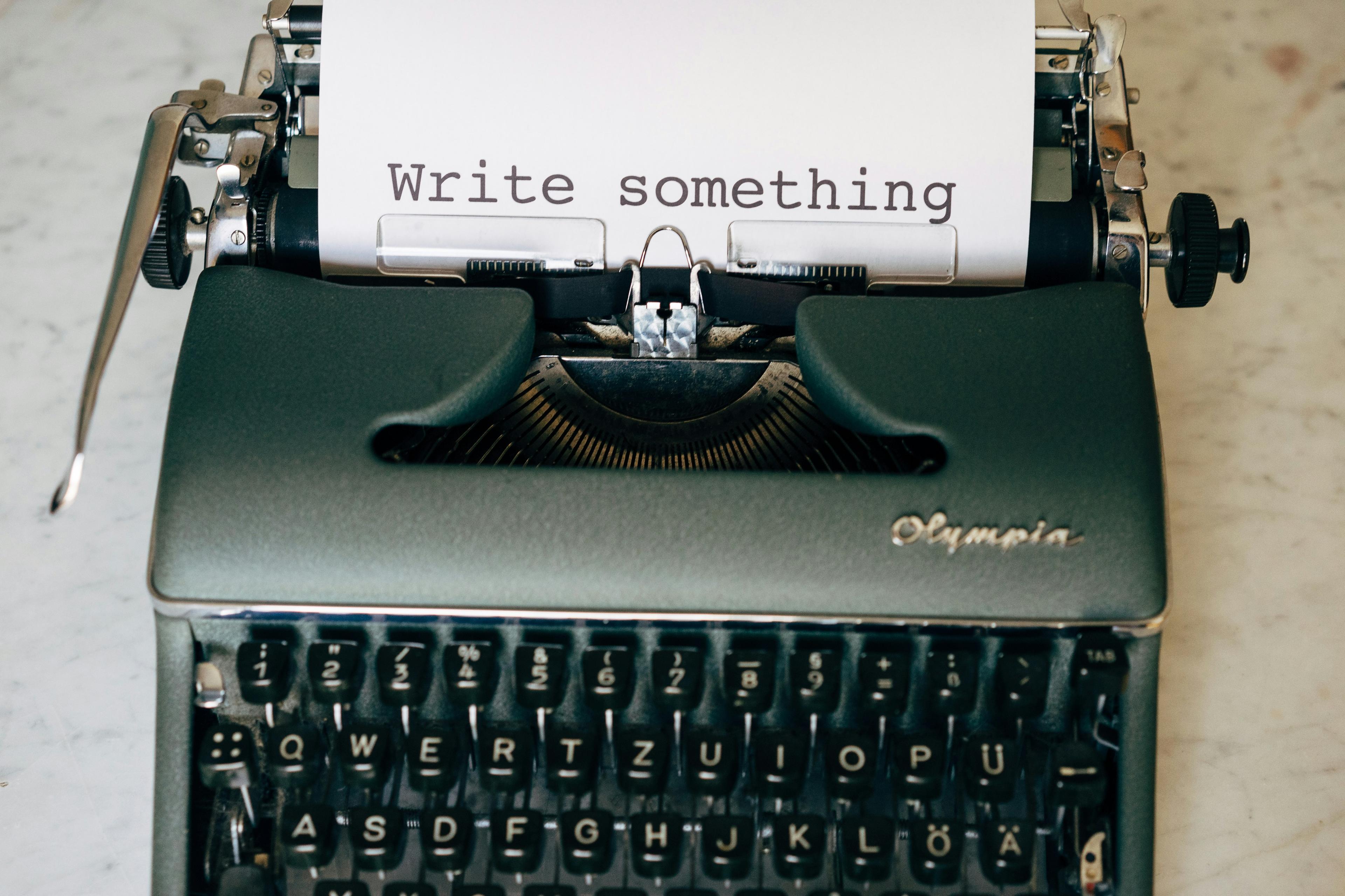 A typewriter saying "write something"