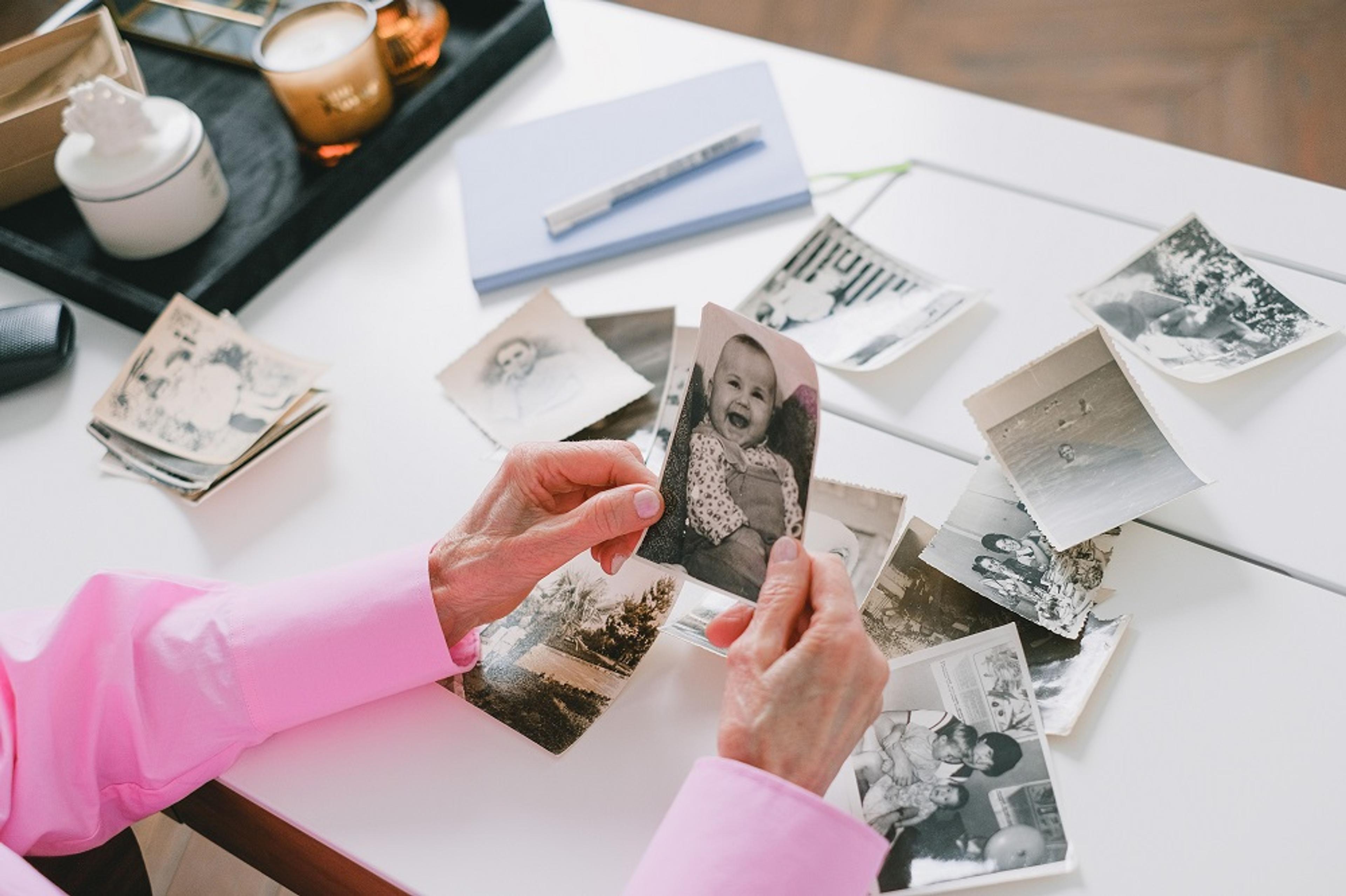 an assortment of family pictures on a desk