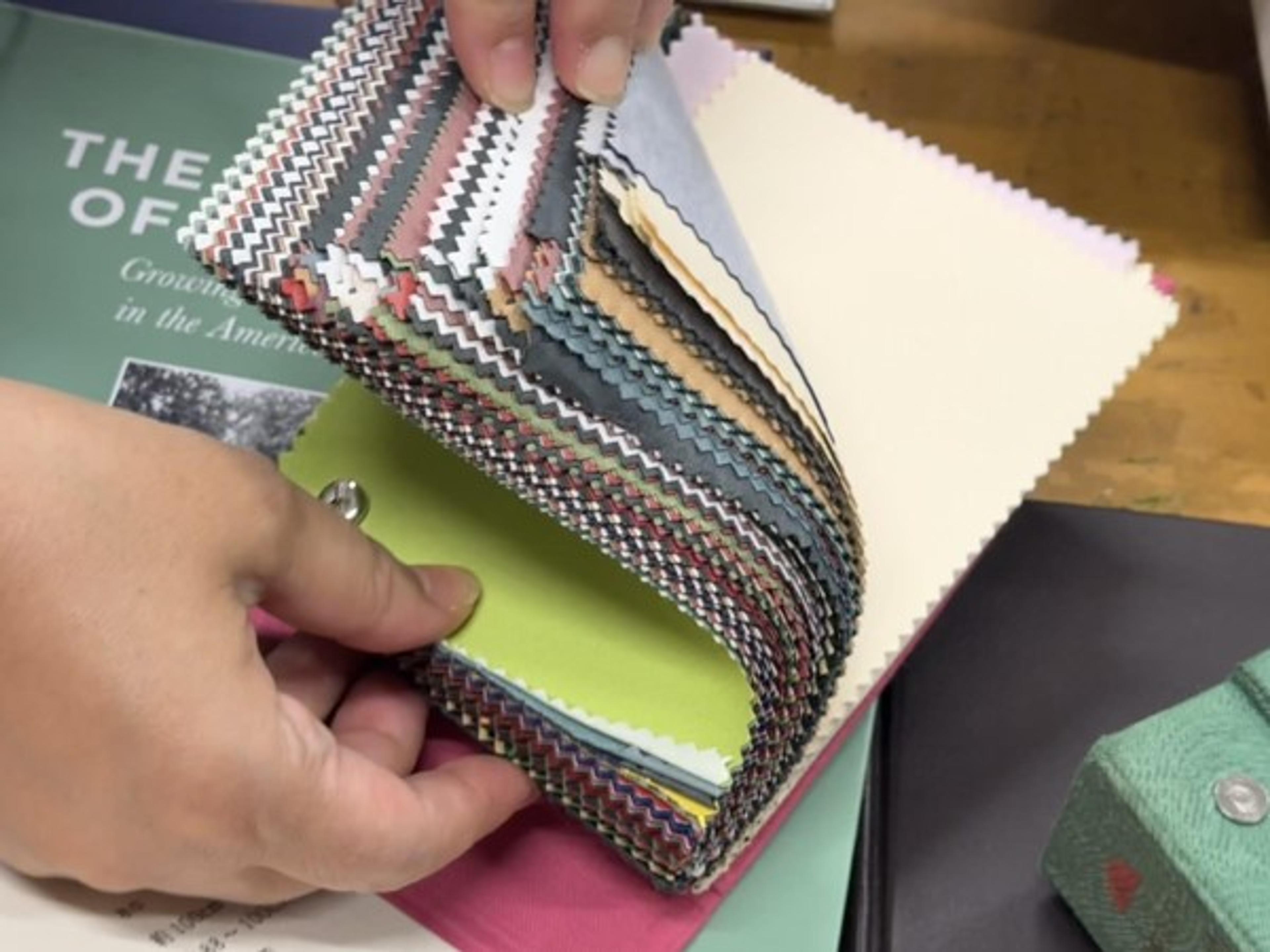 A swatch book makes color and texture choices tangible before binding begins.