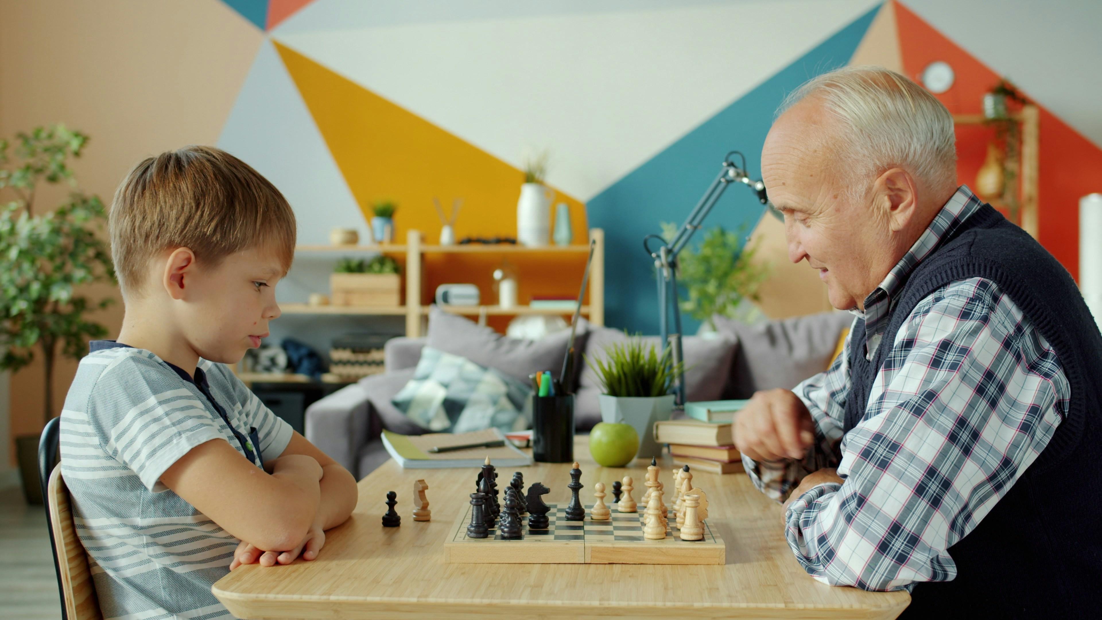 Grandad and child playing chess
