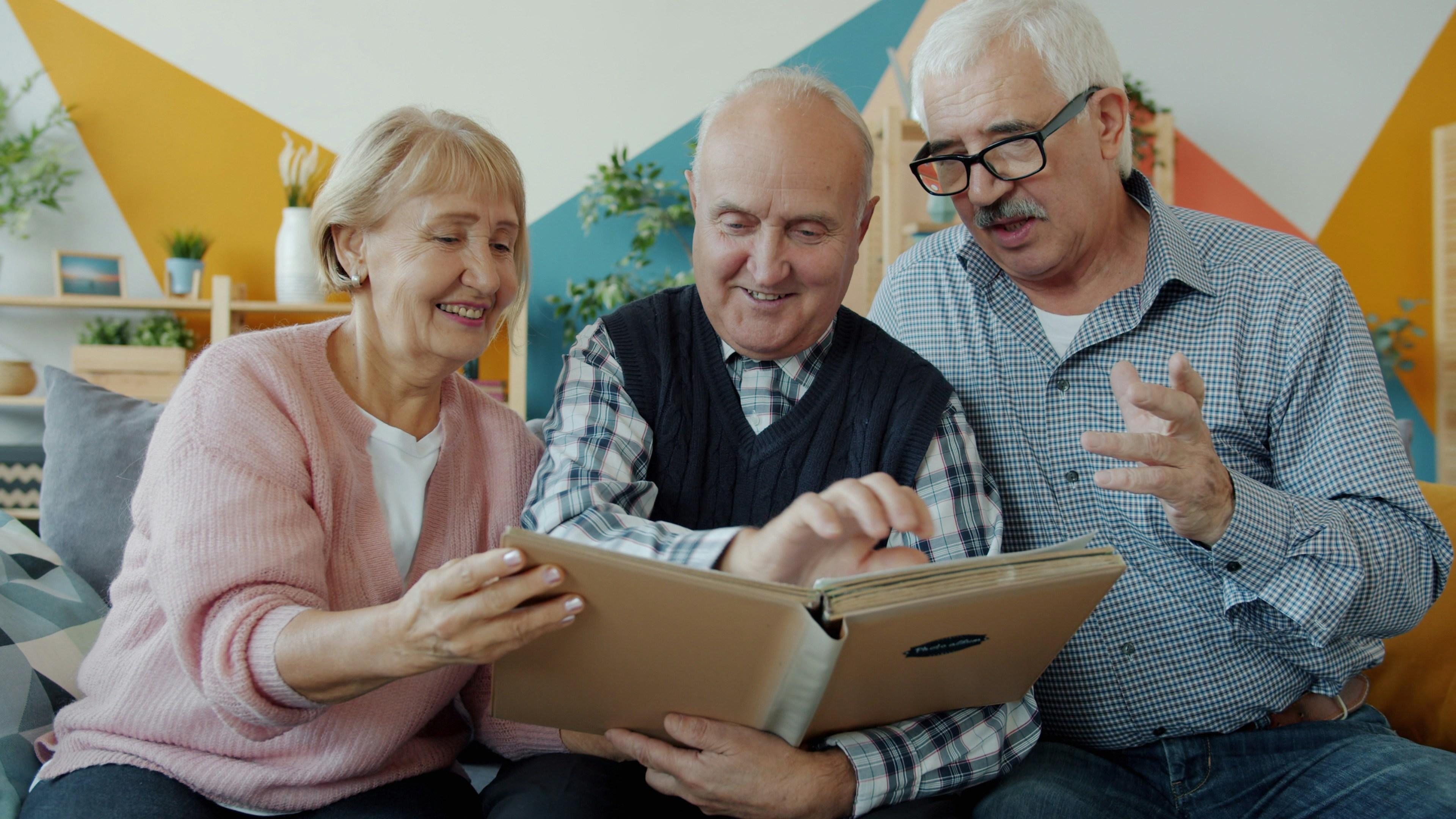 Older people reading a memory book
