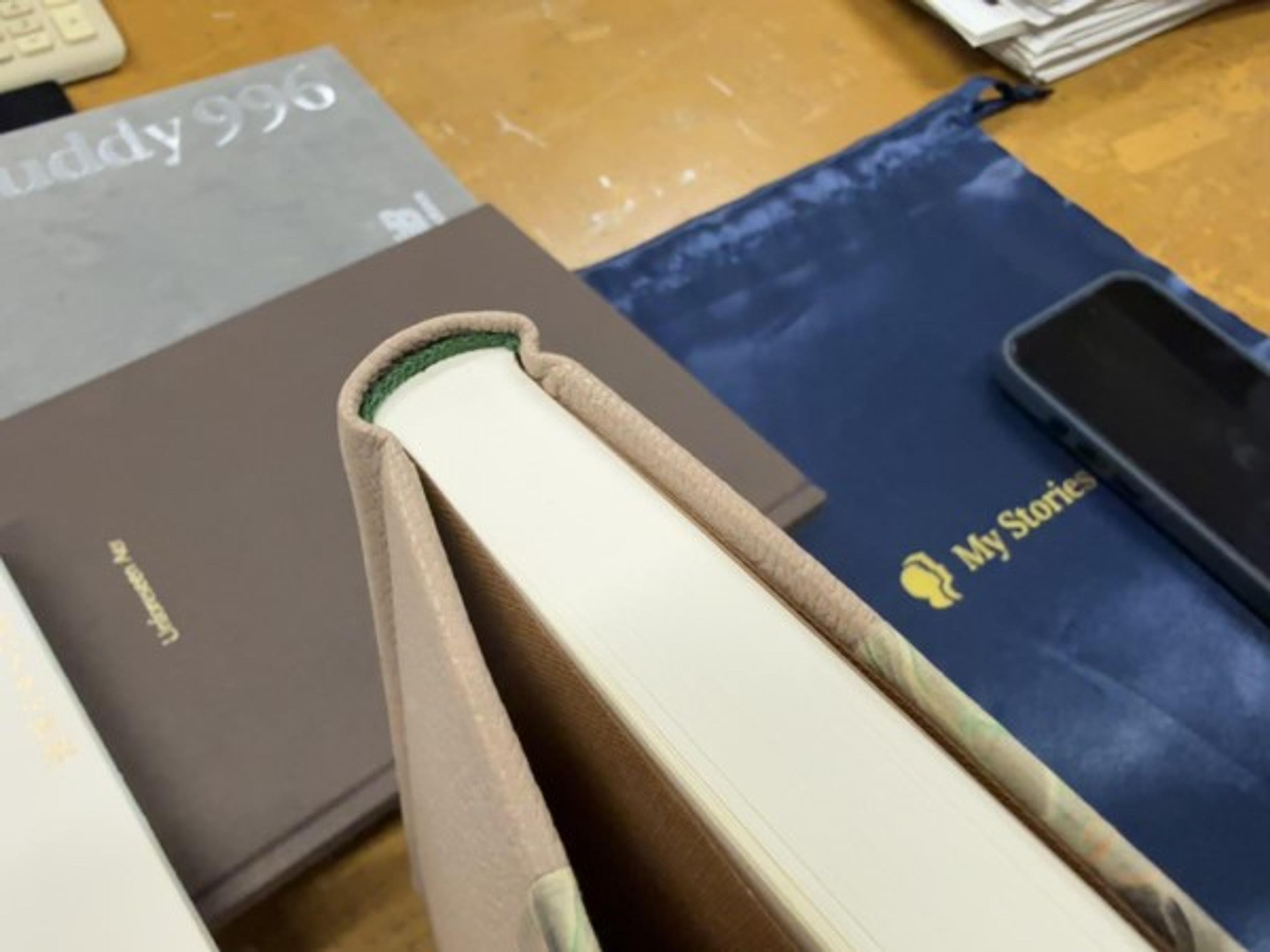 A colored headband adds a narrow accent where the pages meet the spine.