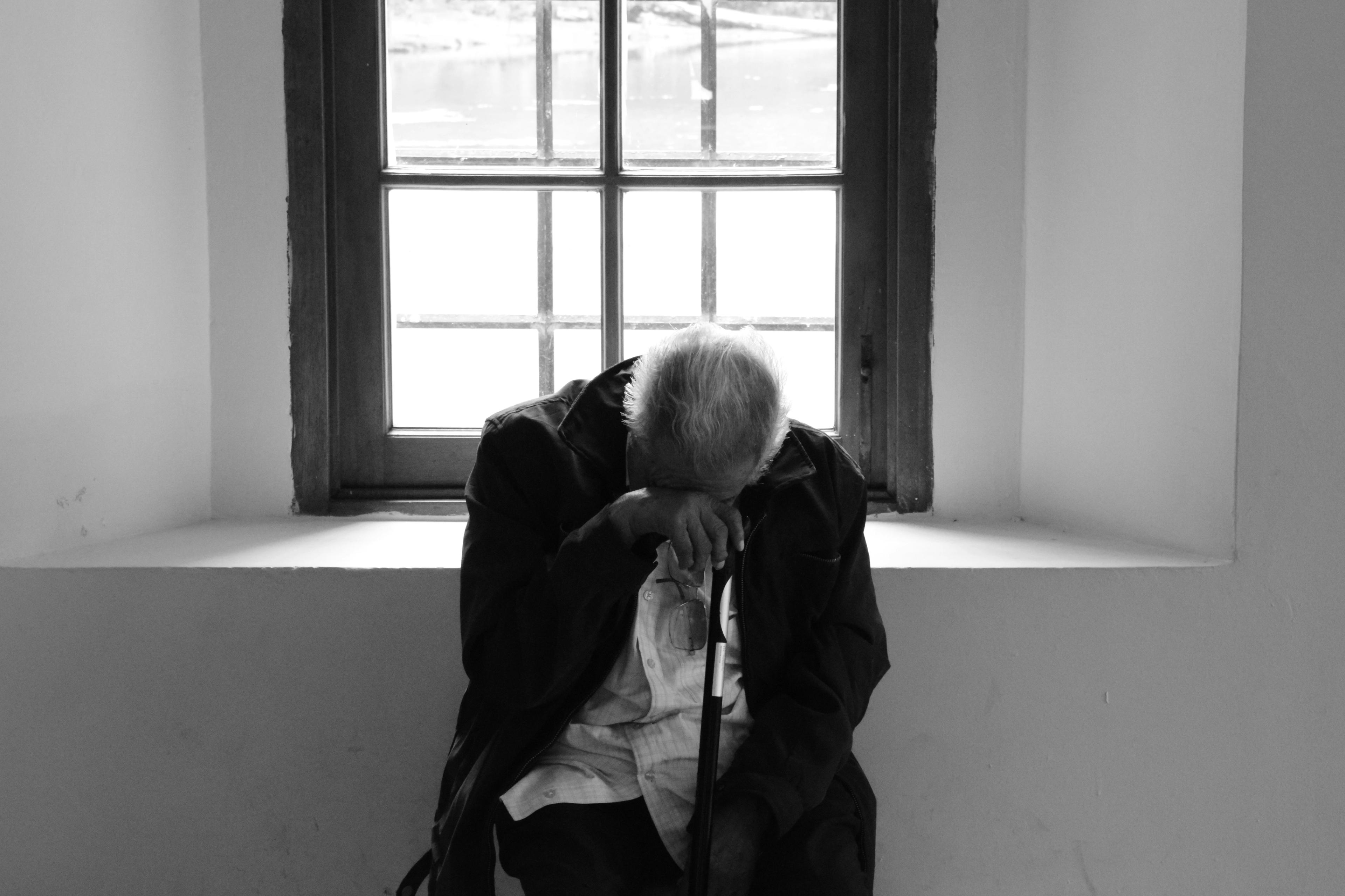 An old man looking down