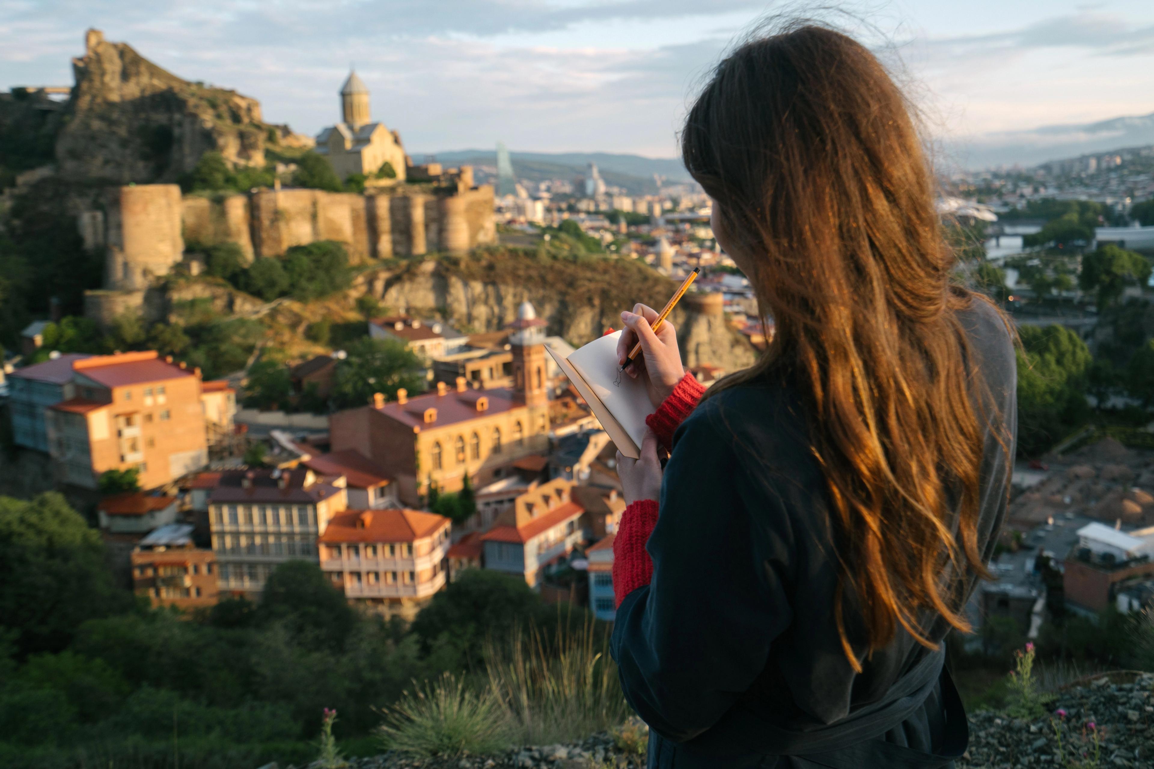 Someone journaling while travelling