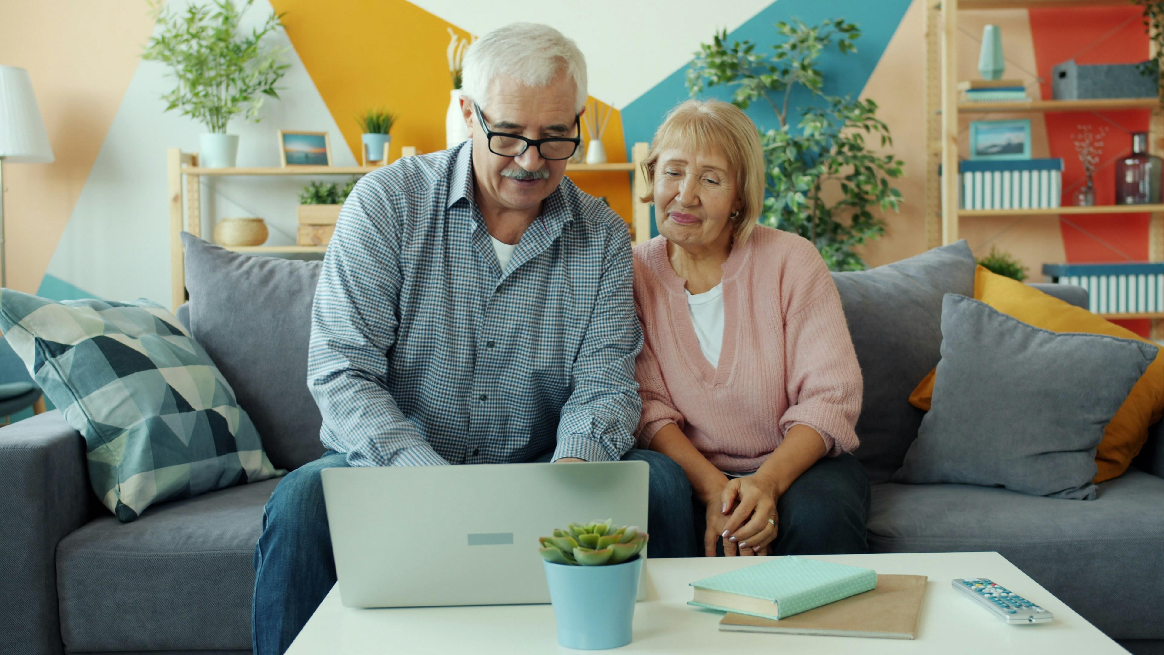 An older couple on a laptop