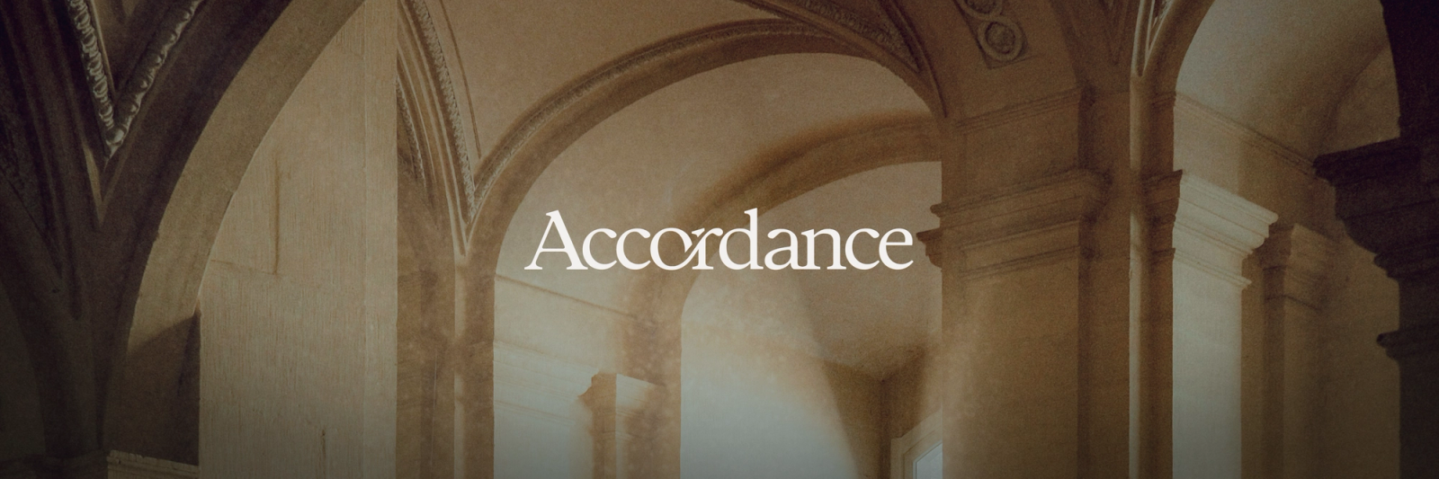 Text "Accordance" over an image of stone architectural arches and pillars.
