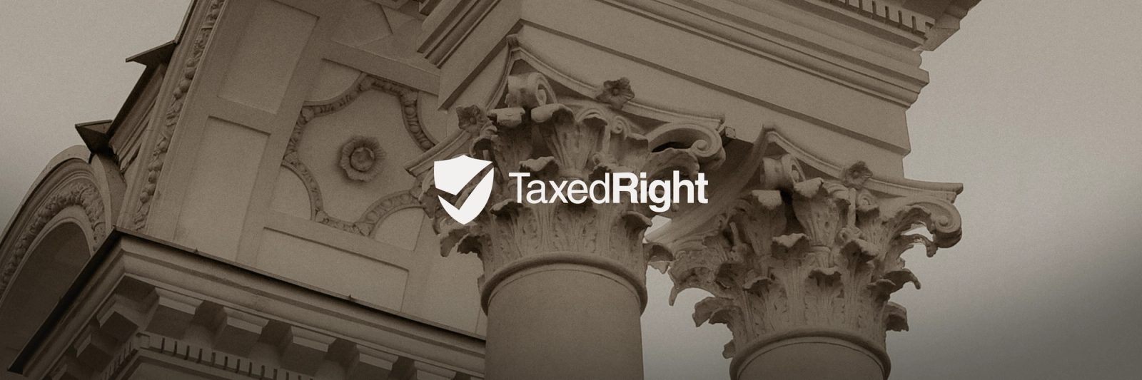 TaxedRight logo with a shield and checkmark over classical architectural columns.
