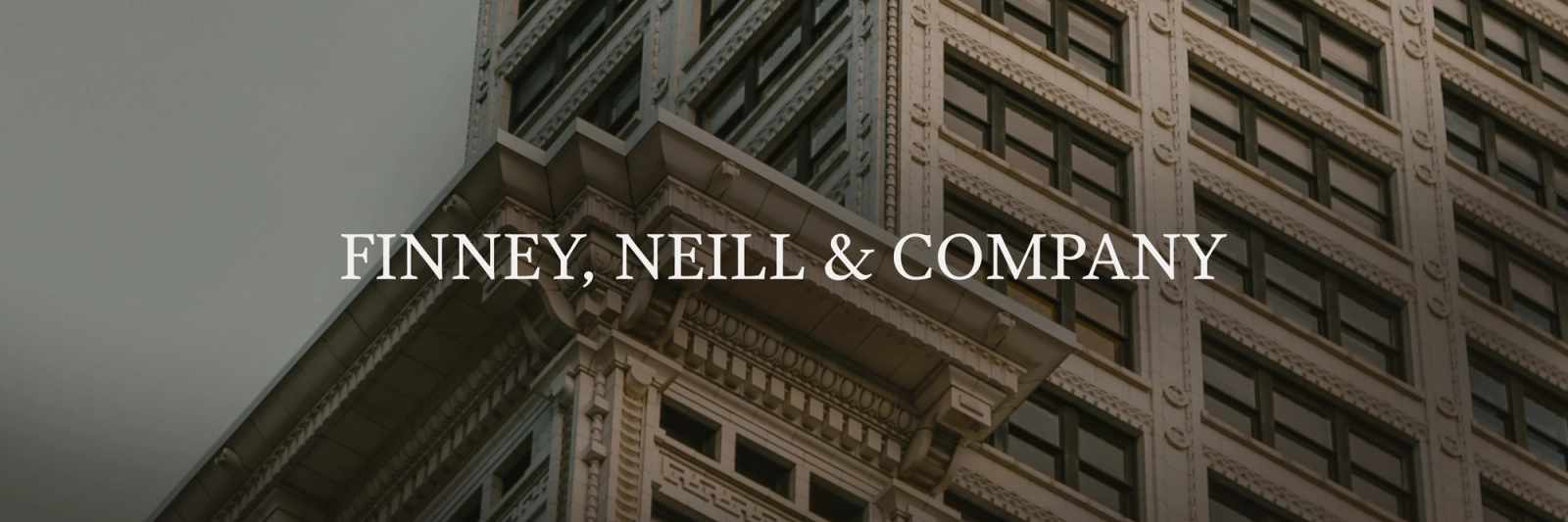 FINNEY, NEILL & COMPANY text overlaid on a detailed building facade.