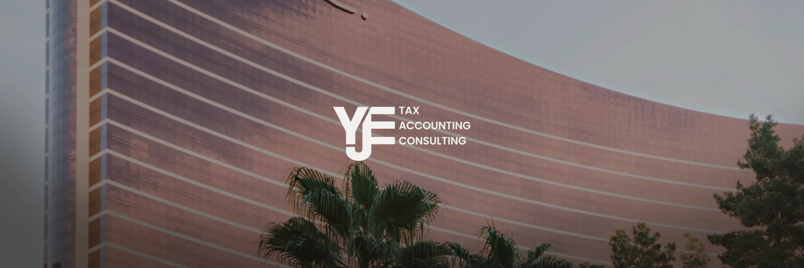 White "YJF TAX ACCOUNTING CONSULTING" logo over a modern building with a curved, reddish-brown facade and palm trees.