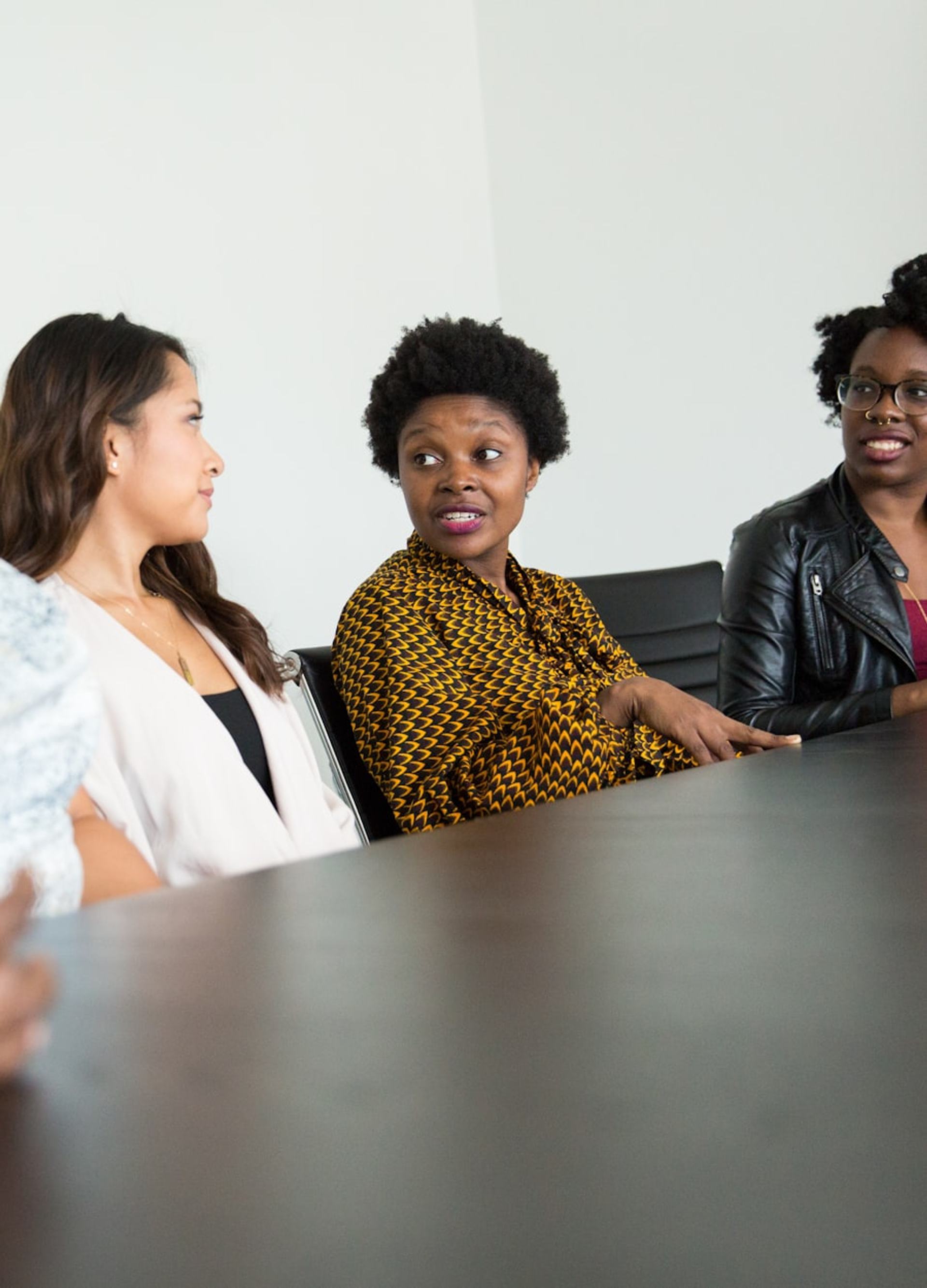 Cyber leaders in conversation around a boardroom table
