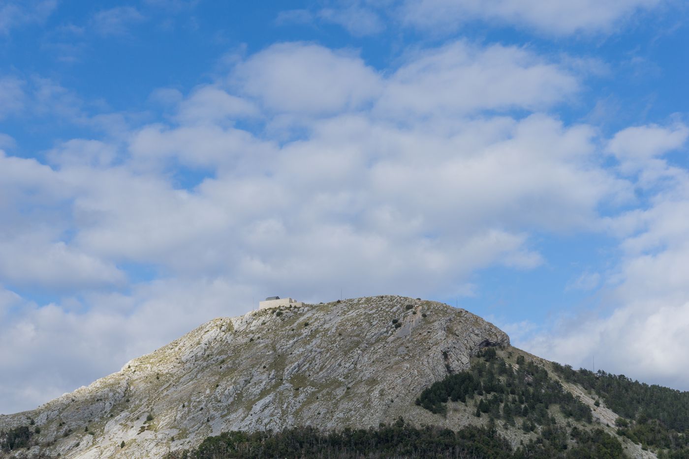 A view of the Jezerski Vrh peak of Mount Lovćen, with the Njegoš Mausoleum visible at its very top.