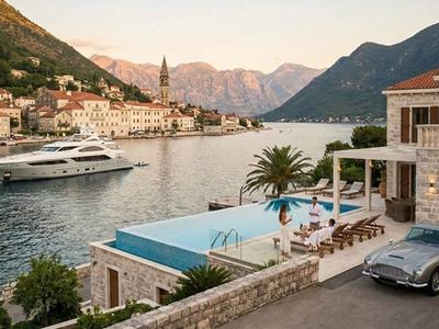 Luxury stone villa, infinity pool, superyacht, and vintage car in the Bay of Kotor, Montenegro