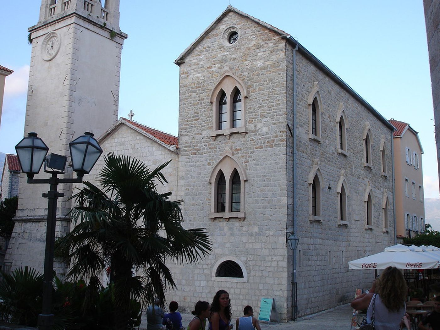A view of the stone facade of the Church of Saint John from a square in Budva's Old Town.