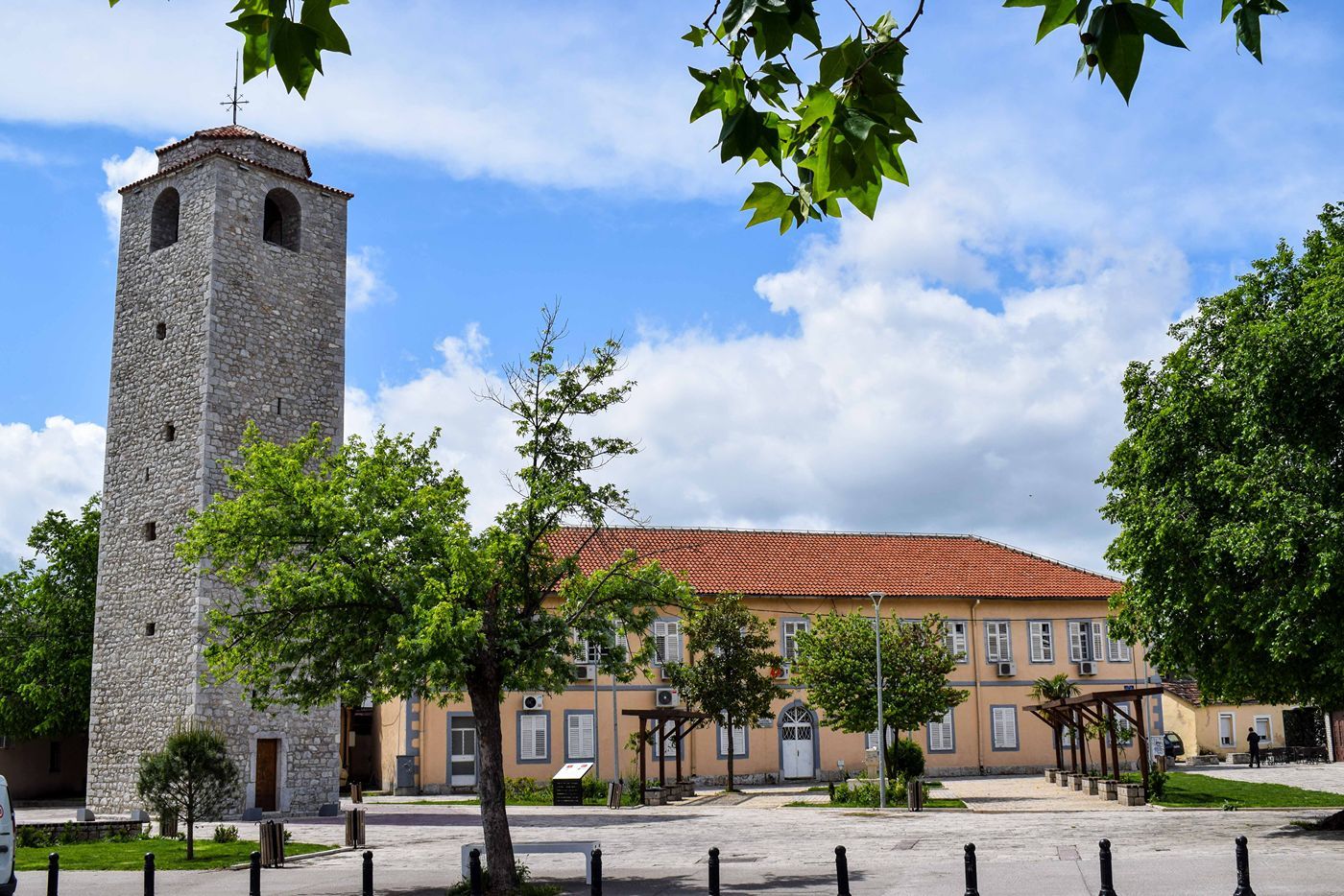 View of the historic Clock Tower and an adjacent traditional building in Stara Varoš, Podgorica.