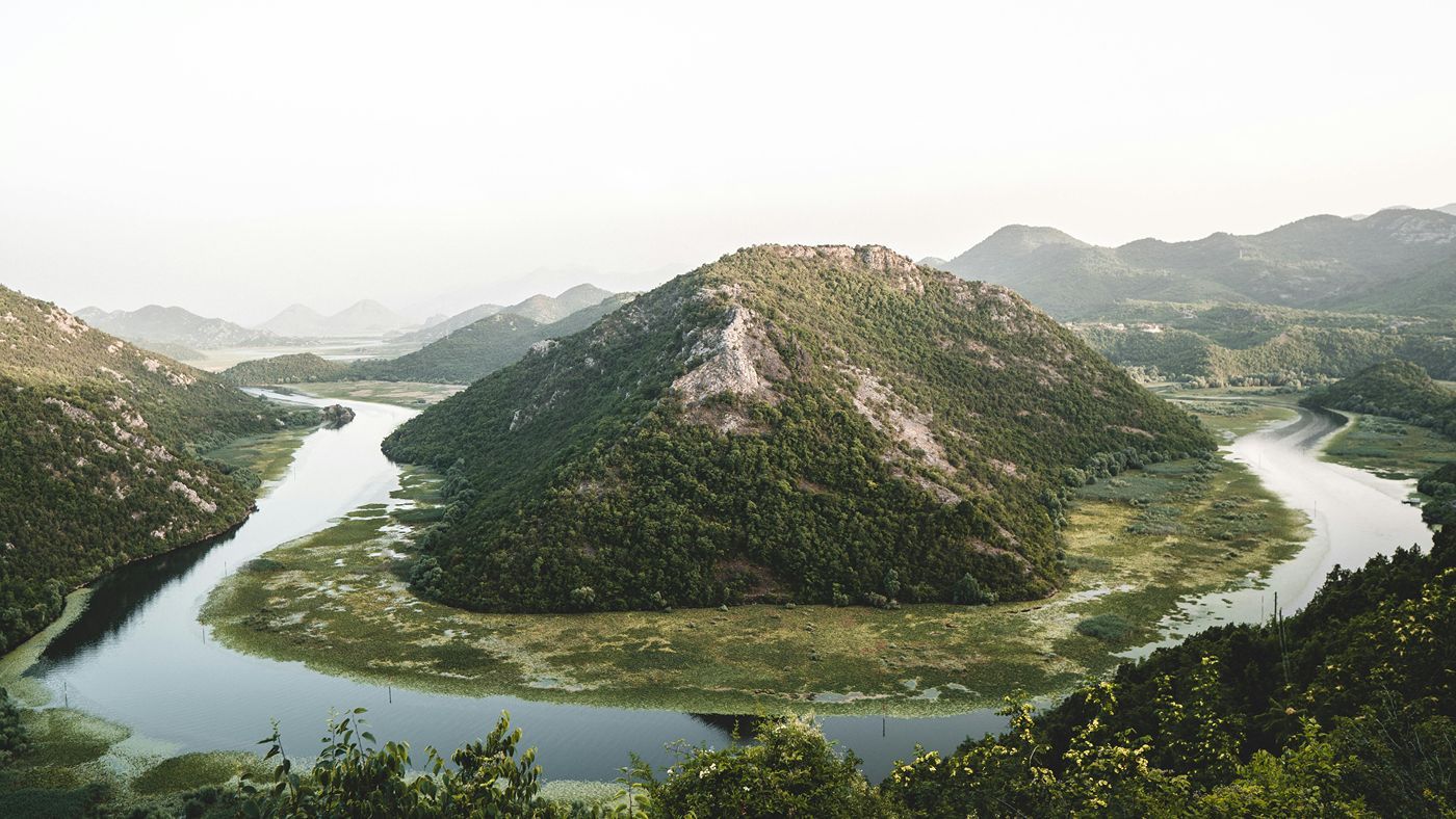 The iconic horseshoe bend of the Rijeka Crnojevića river at Pavlova Strana viewpoint, Skadar Lake National Park.