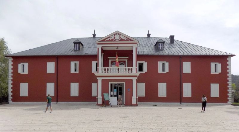 The grand red facade of King Nikola's Museum, the former royal palace in Cetinje, Montenegro.