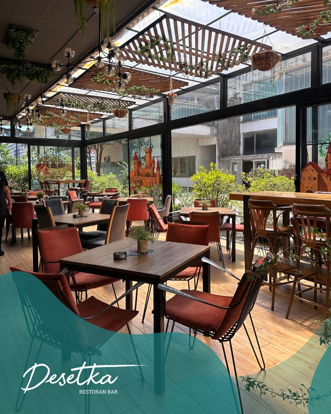 A detail of the modern, industrial-style decor at Desetka, with black metal shelves and contemporary lighting.