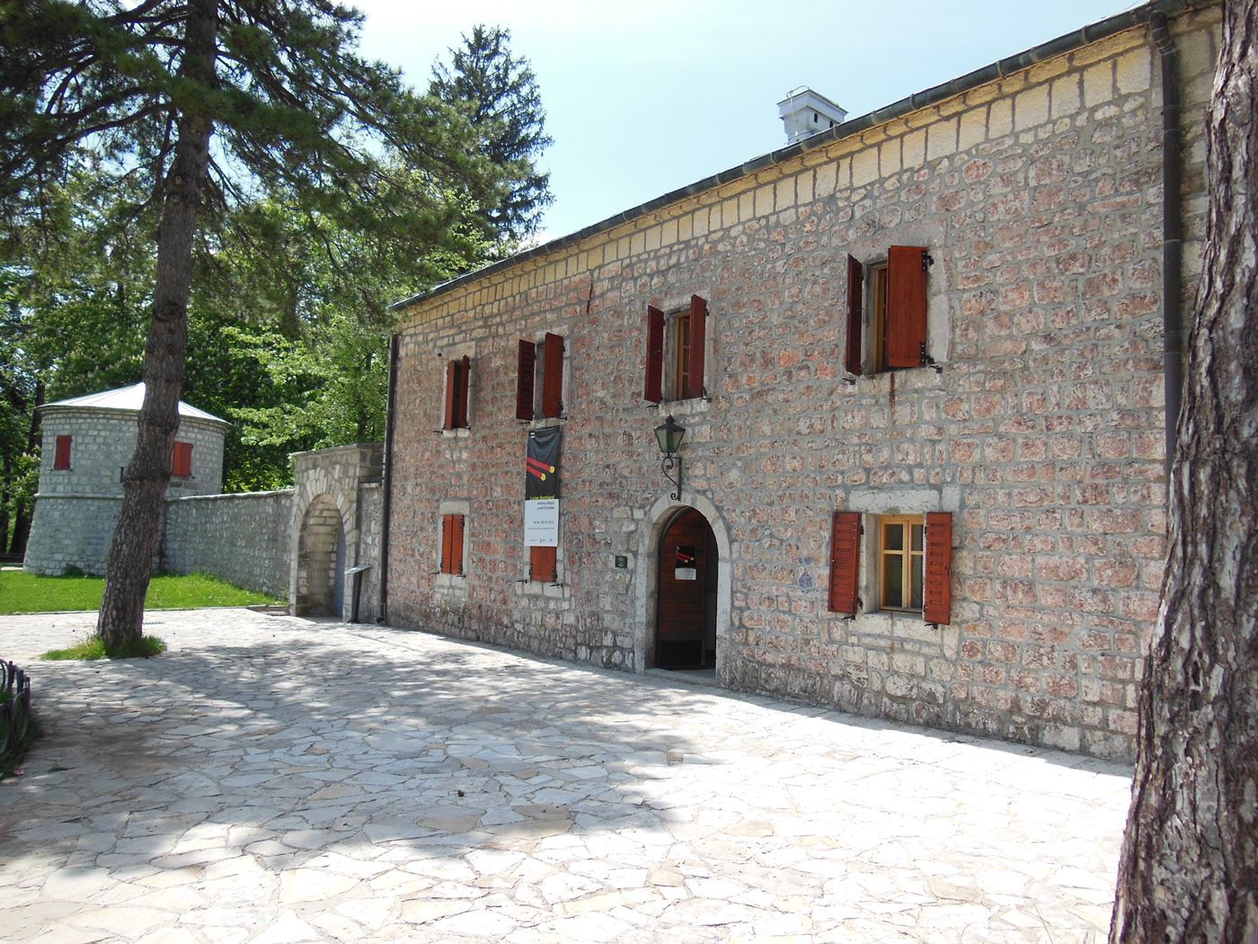 The stone courtyard and entrance to the Njegoš Museum inside Biljarda Hall in Cetinje.