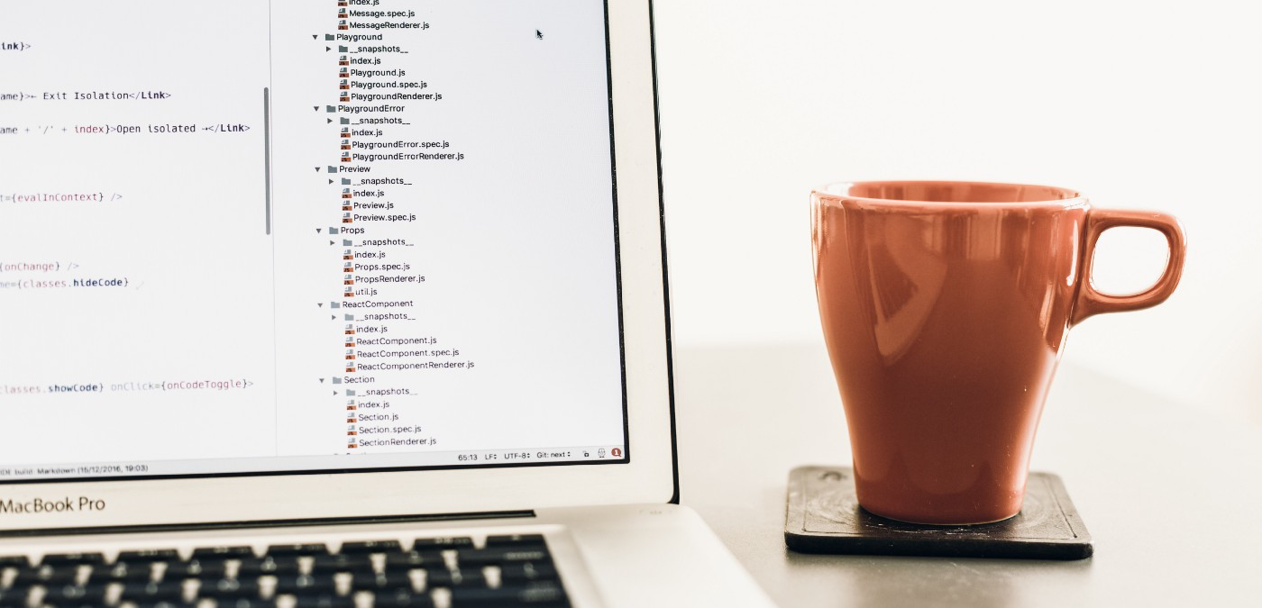 “turned on MacBook Pro near brown ceramic mug” by Artem Sapegin on Unsplash