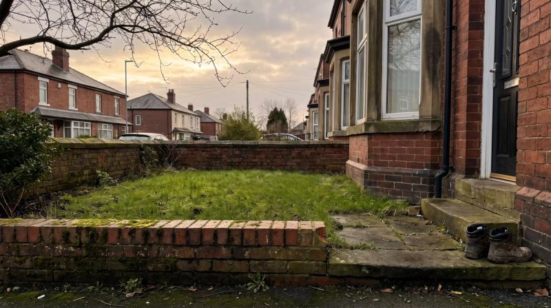 A quiet front garden of an older British house in soft evening light
