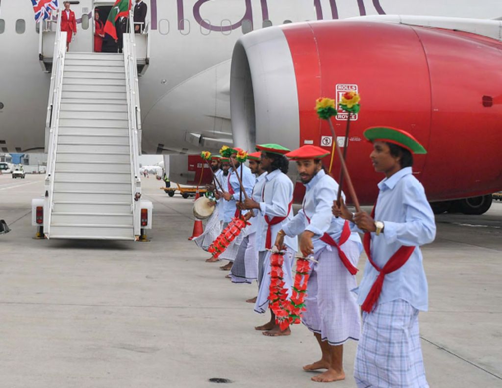 Tourists arriving on British Airways receiving a traditional welcome reception at Velana International Airport