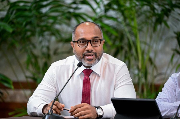 Minister Ali Ihusaan speaking at a press conference at the President's Office