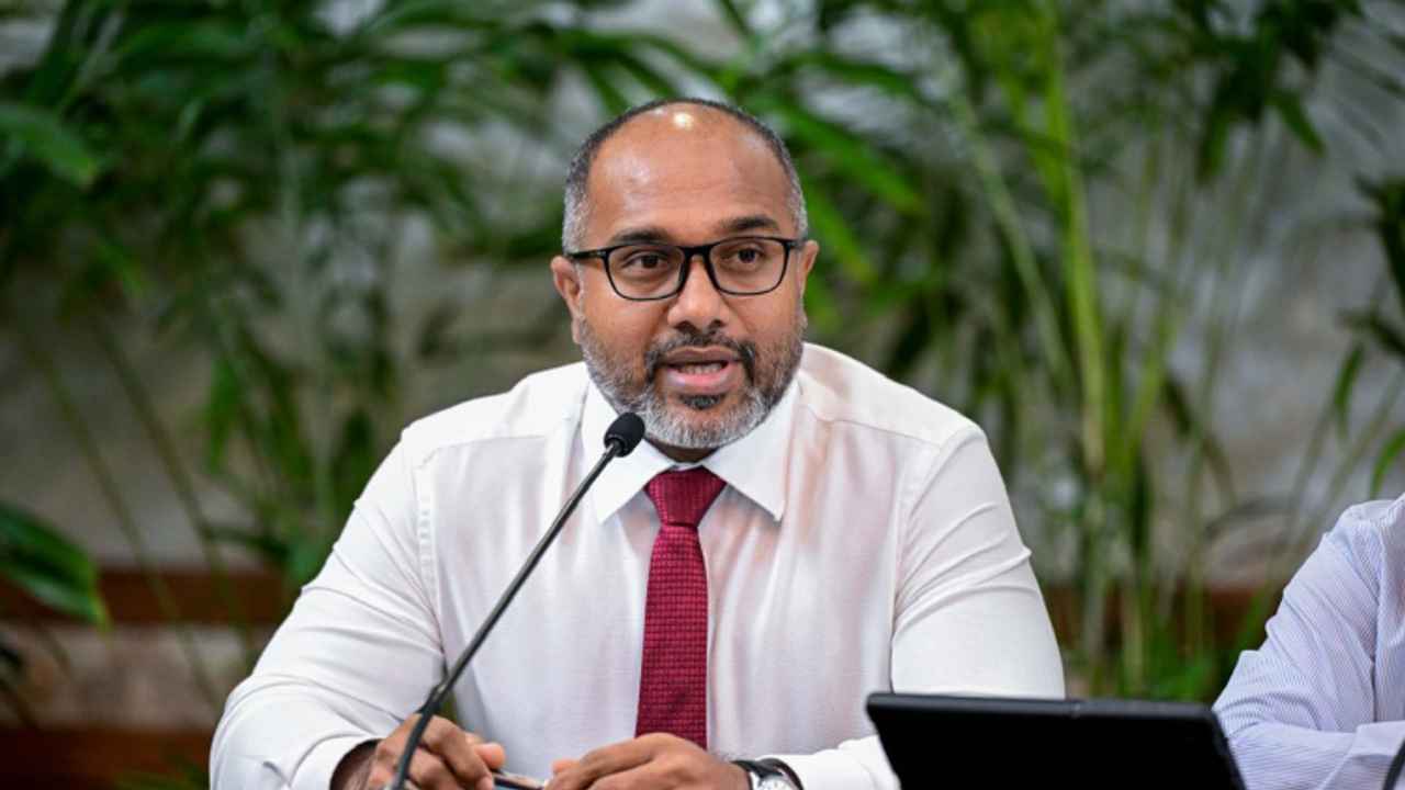 Minister Ali Ihusaan speaking at a press conference at the President's Office