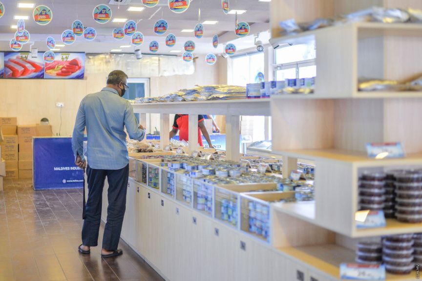 A man in a blue shirt, observing products at a MIFCO outlet