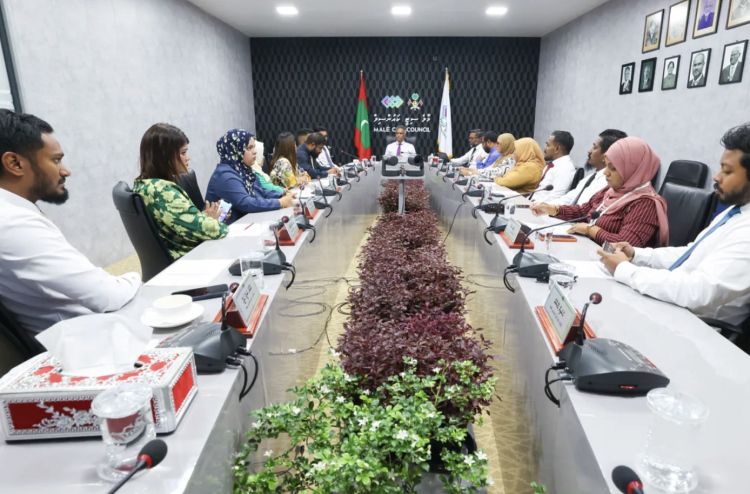 Members of Malé City Council seated at a council meeting