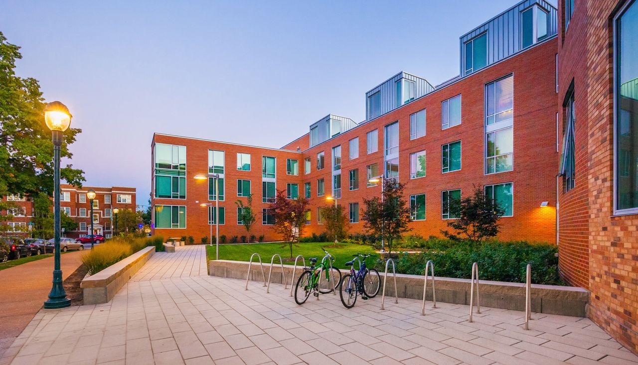 Back courtyard provides green space and bike storage for the lofts at washington university saint louis residents completed by Arbolope studio