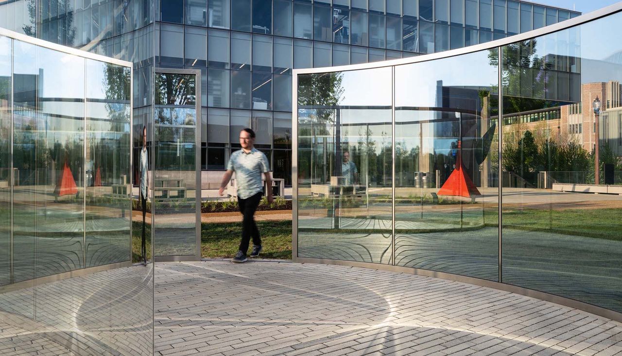 People walking through Biselected circle at washington university saint louis missouri project completed by arbolope studio