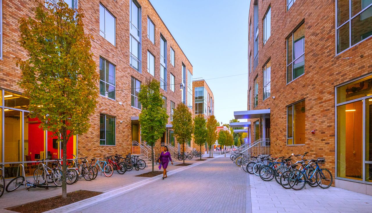 Inside cut through pathway pedestrian mew for pedestrians to walk through the three building site at the lofts at washington university saint louis mo completed by arbolope studio