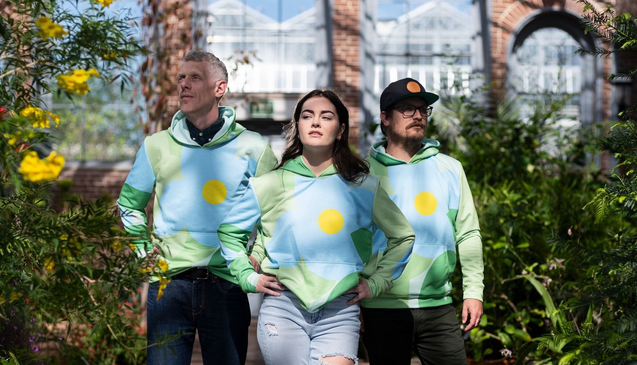 People posing wearing the designed hoodies by arbolope studio for the society of ethnobiology conference in st louis missouri.