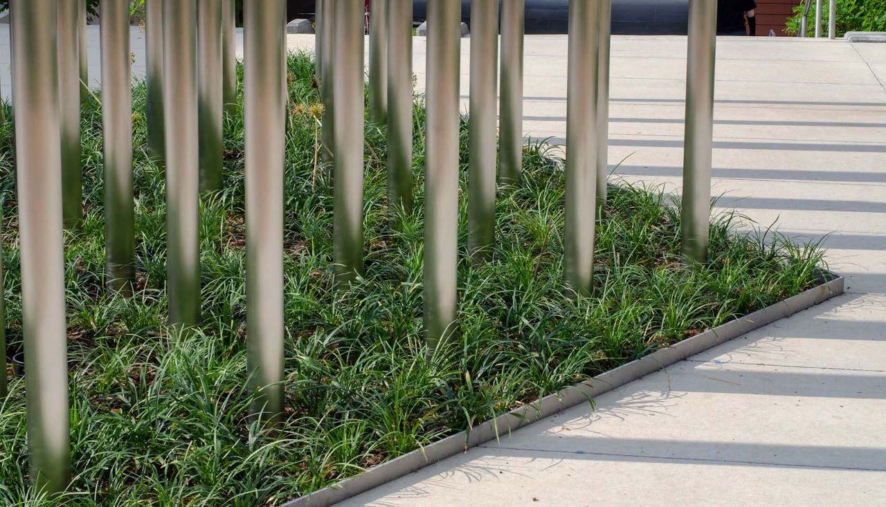 Up close image of triangle planting beds surrounding multiple anemometers on washington university campus in st louis missouri