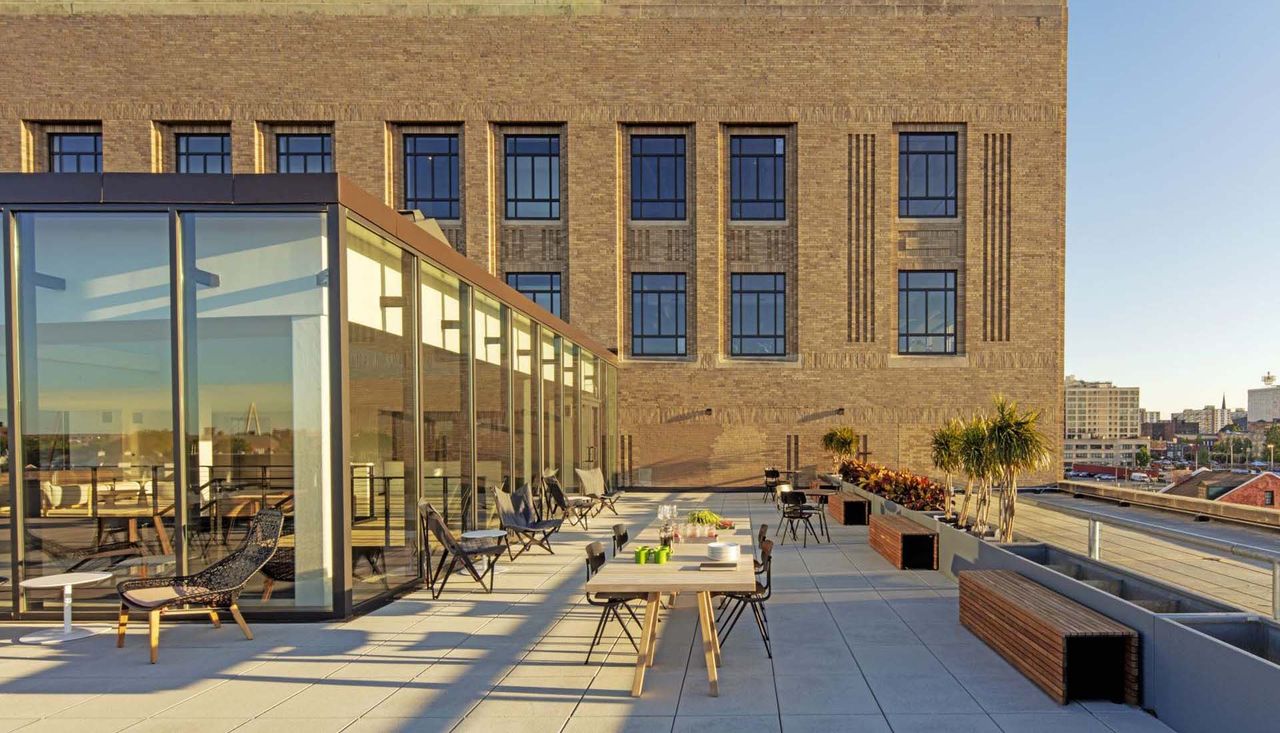 Upper courtyard and gathering space at the stl post dispatch building in st louis missouri designed by arbolope studio