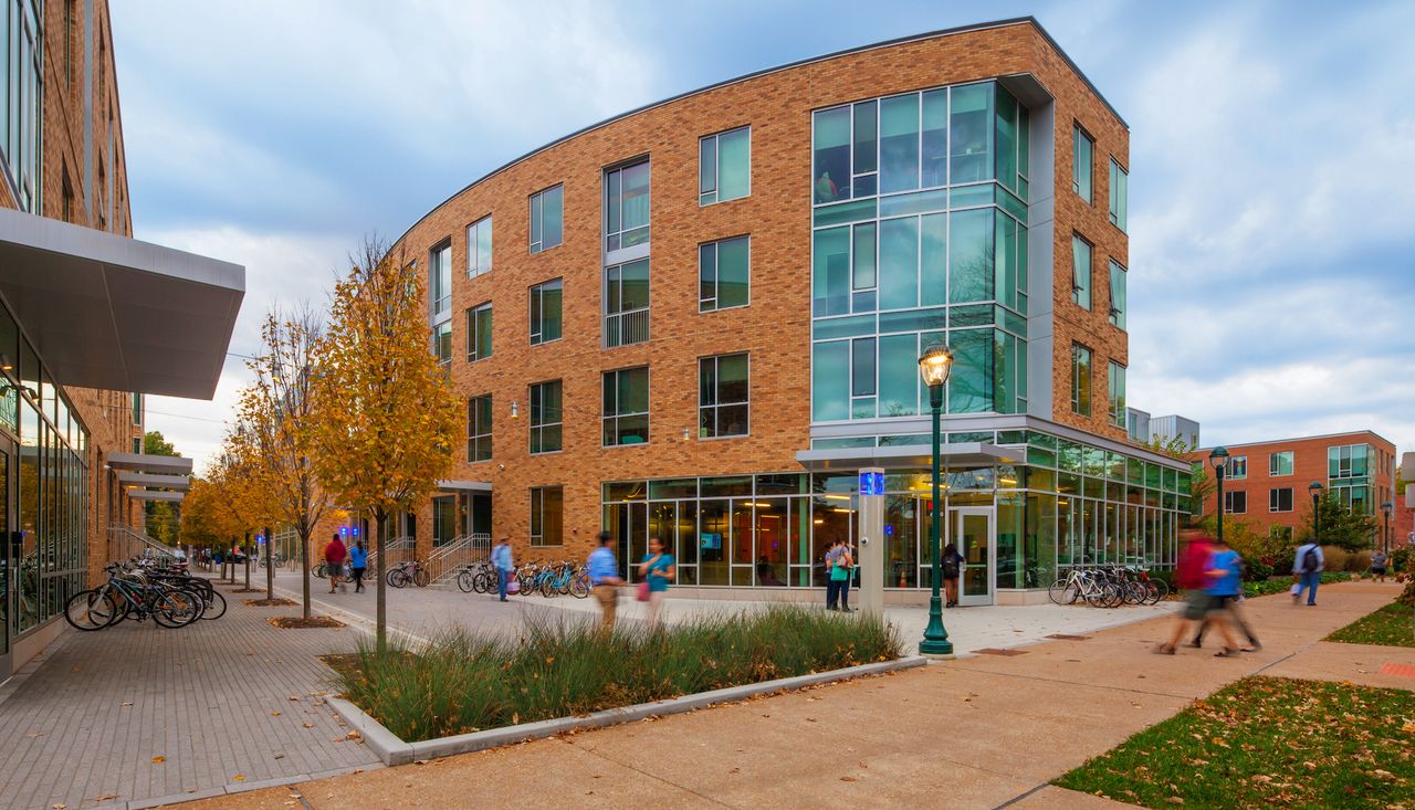Pedestrians in the plaza of the lofts at washington university saint louis mo surrounded by raingardens