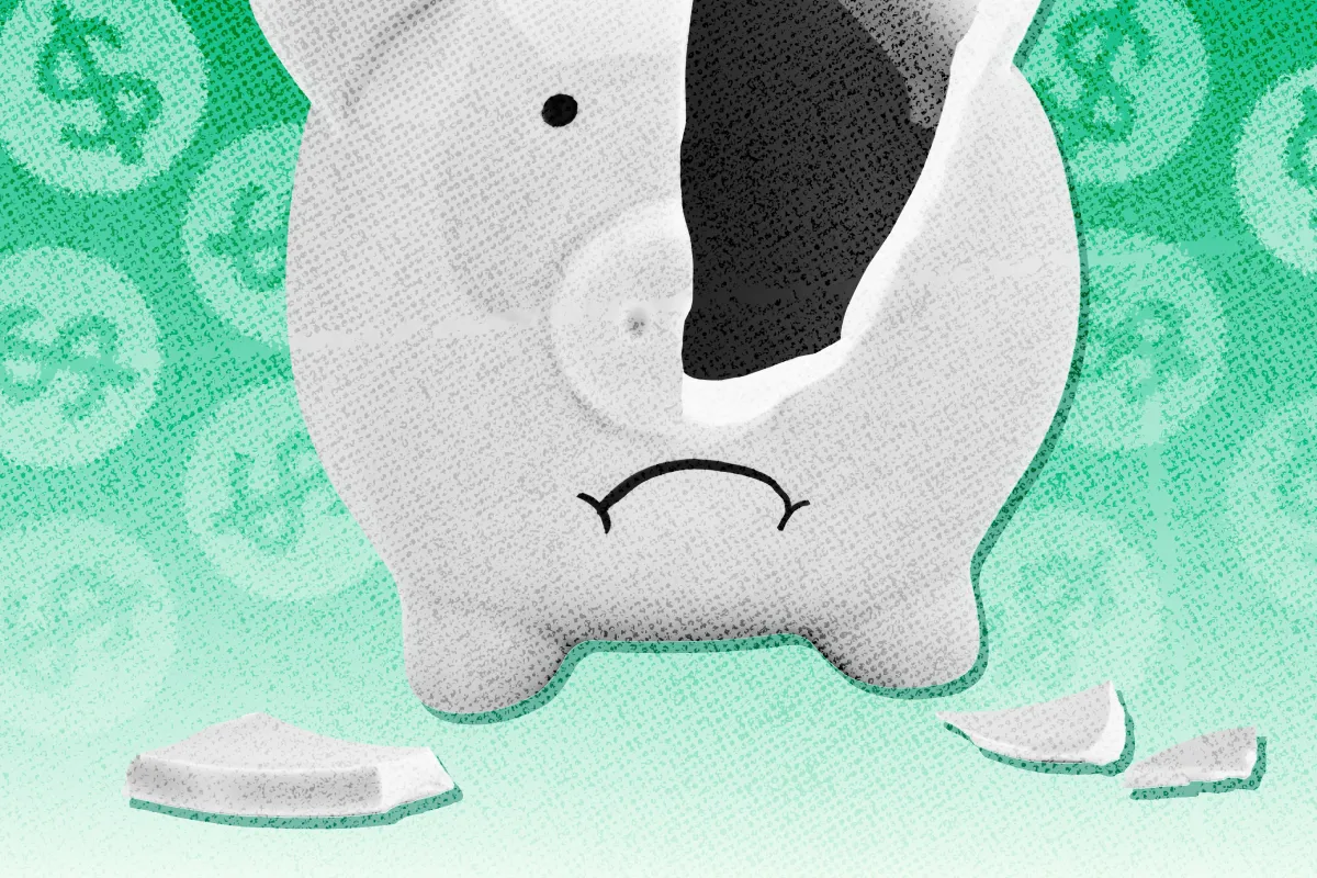 A broken piggy bank surrounded by dollar signs.