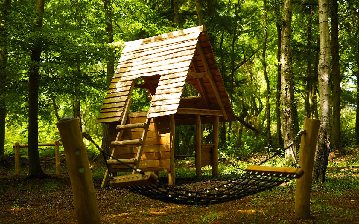 Photograph of a treehouse in the forest at Wyvernwood visitor attraction.  Photo credit: www.wyvernwood.co.uk